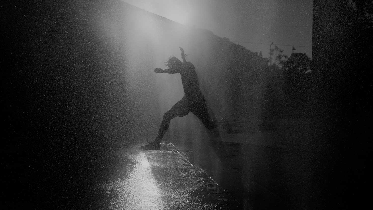 Kids playing with water in Vienna, captured in black and white by Philipp Hafner